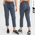 Nuevos pantalones de yoga Pantalones de mujeres con cordón con cordón y bolsillos Mujeres Pantalones deportivos Capri tejido febric febric pantalones de chándal esenciales